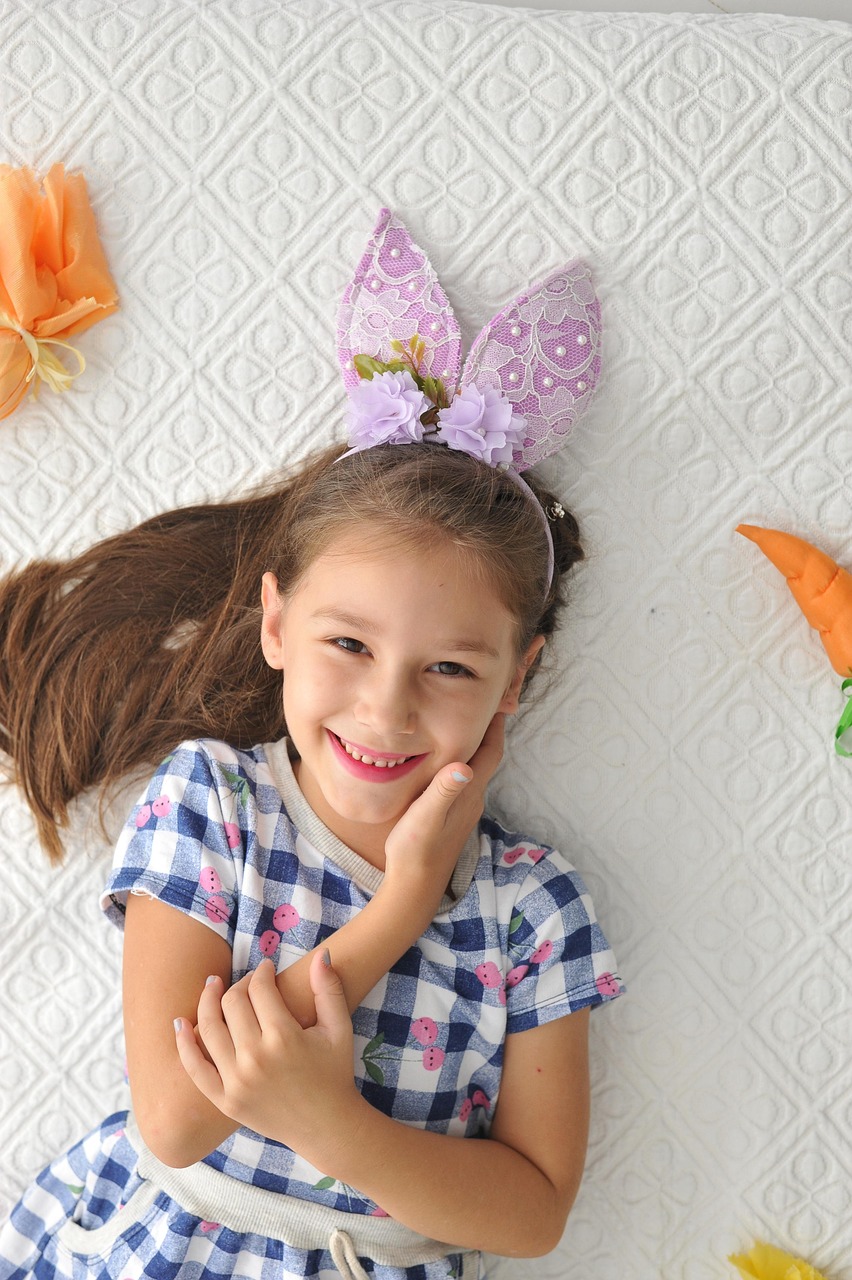 Child wearing a handmade bunny ears headband for an Easter craft